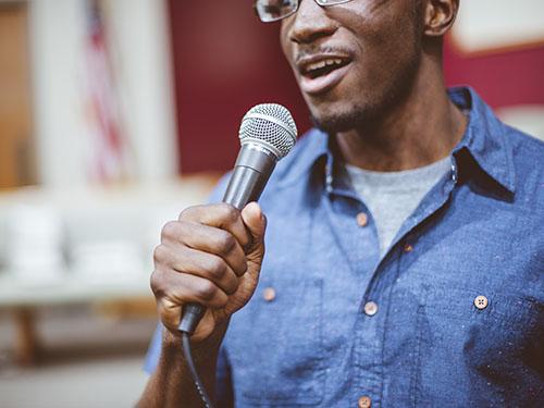 A man holds a microphone